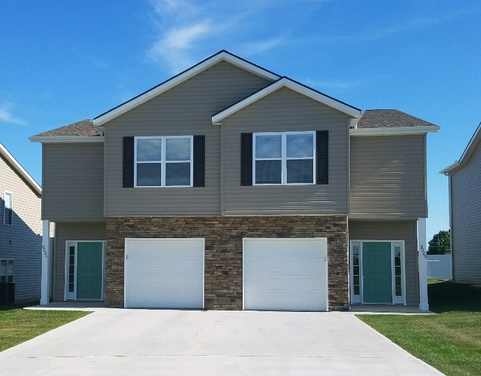 The front view of a Stone Creek townhome on a sunny day